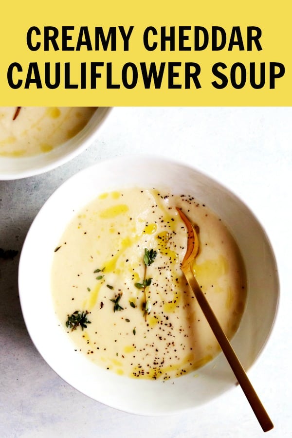 This vegetarian Creamy Cheddar Cauliflower Soup is the perfect bowl to warm up with! The cauliflower keeps it light and healthy and the cheddar adds such a fun, indulgent taste. thetoastedpinenut.com #thetoastedpinenut #vegetarian #healthy #soup #glutenfree #creamy #cheddar #cauliflower #cauliflowersoup