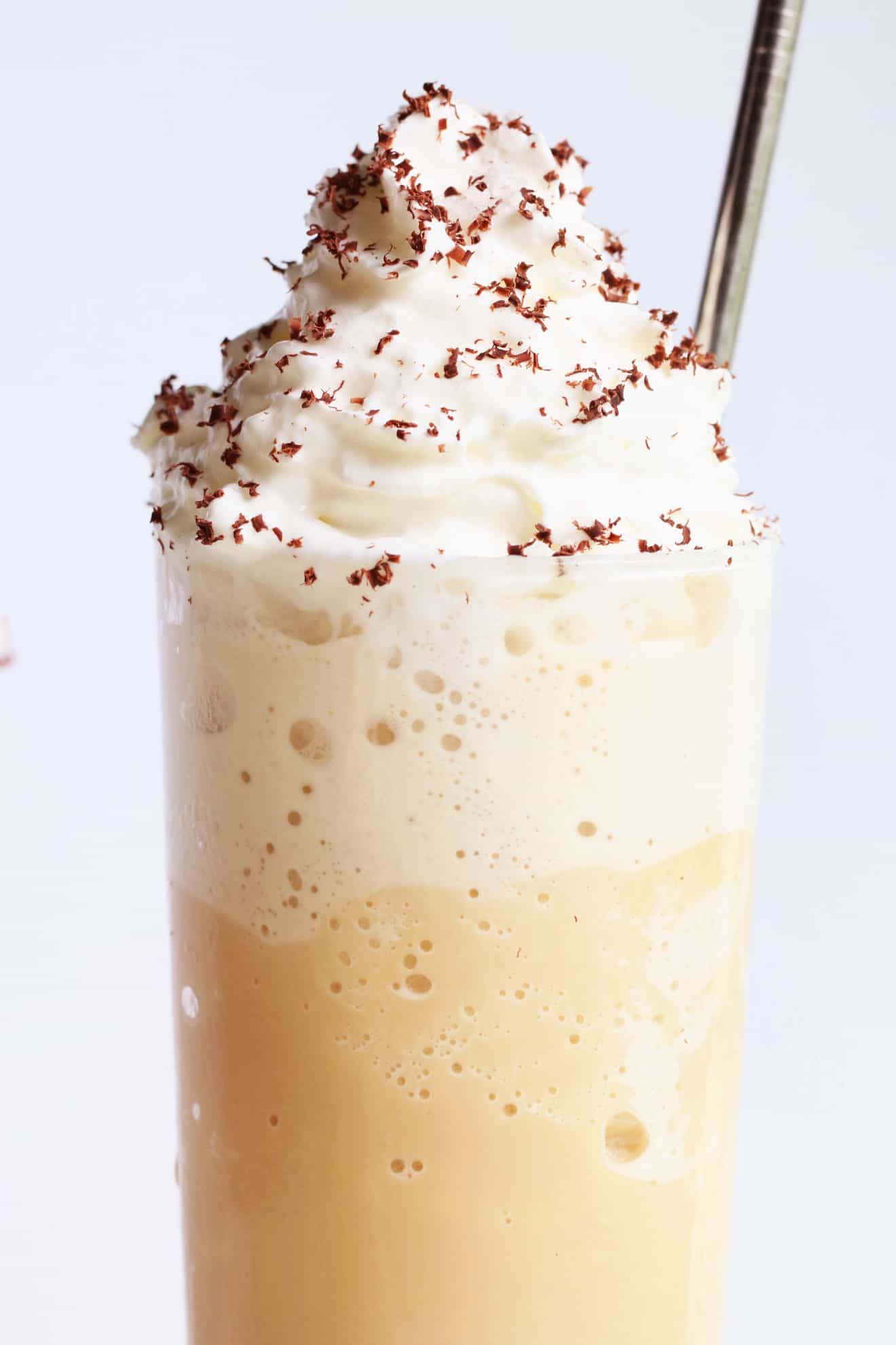 frozen iced latte with whipped cream and grated chocolate