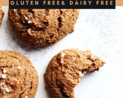 overhead image of a ginger molasses cookie on a white counter with a bite taken out, text overlay "ginger molasses cookies gluten free & dairy free"