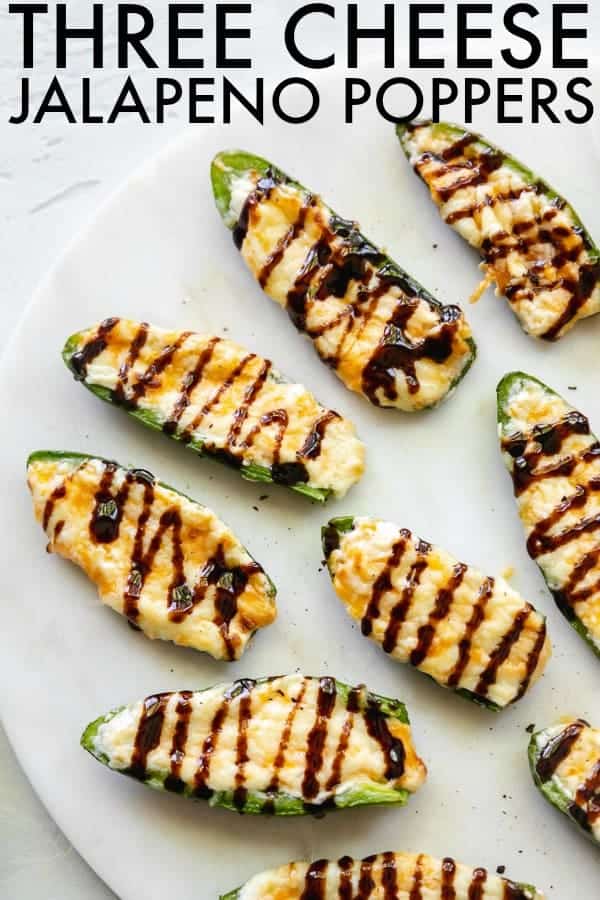 Fun and tasty Three Cheese Jalapeño Poppers that are the trifecta of delicious flavor: spicy jalapeño, creamy cheese, and sweet drizzle on top! thetoastedpinenut.com #thetoastedpinenut #jalapenos #jalapenopoppers #threecheesejalapeno #cheesyjalapenopoppers #gamedayappetizer #lowcarbappetizer #glutenfreeappetizer