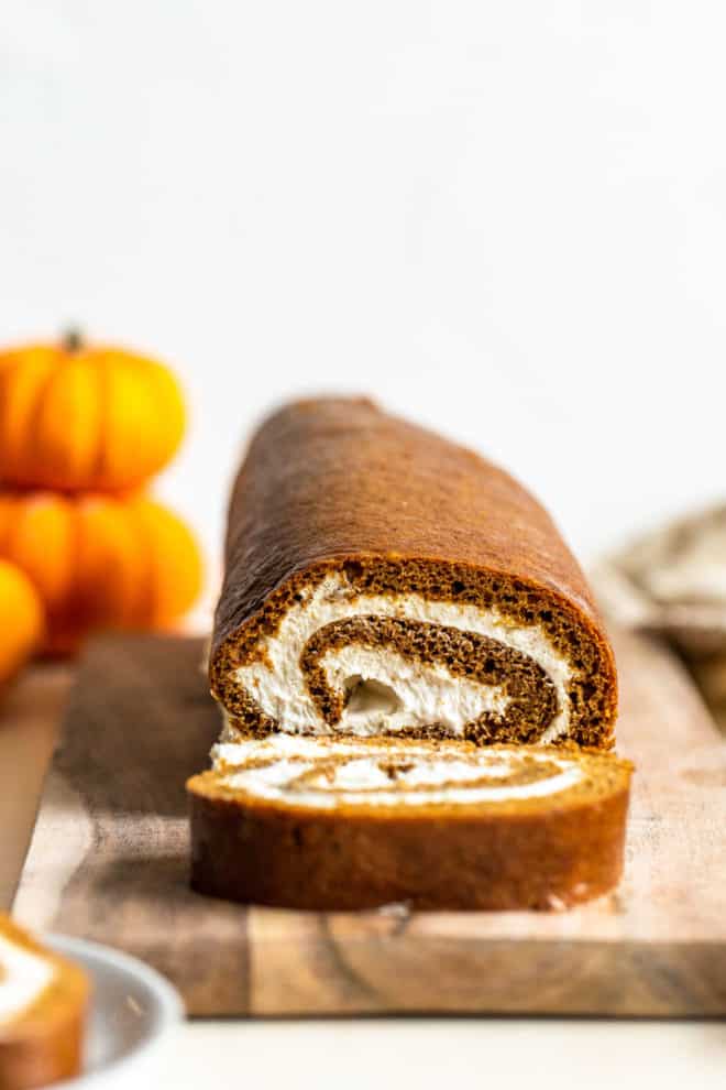 side view of the swirl pumpkin roll with one slice cut off