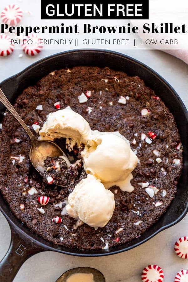 Cozy up with this chocolatey and minty Gluten Free Peppermint Brownie Skillet! It's crispy around the edges, gooey in the center, and a crowd pleaser (assuming you can share)! thetoastedpinenut.com #thetoastedpinenut #brownies #glutenfreebrownies #brownieskillet #peppermint #peppermintrecipes #peppermintbrownies