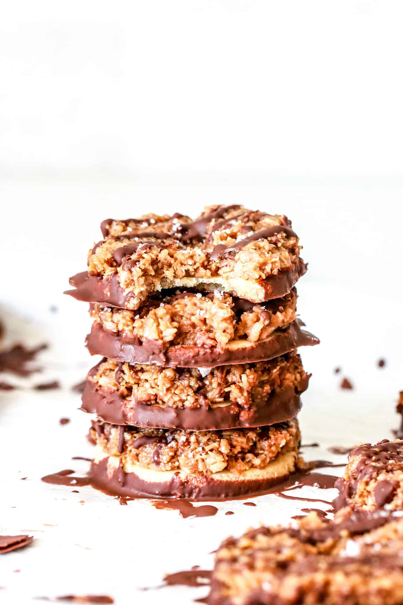 stack of homemade girl scout samoas cookies on white background