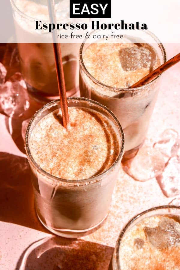 group of iced horchata glasses on pink table pinterest image
