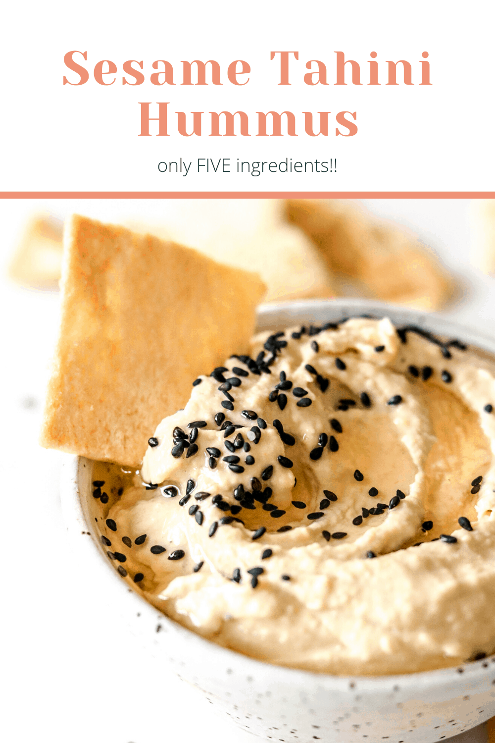 white speckled bowl filled with sesame tahini hummus with black sesame seeds and a pita chip dipped in pinterest image