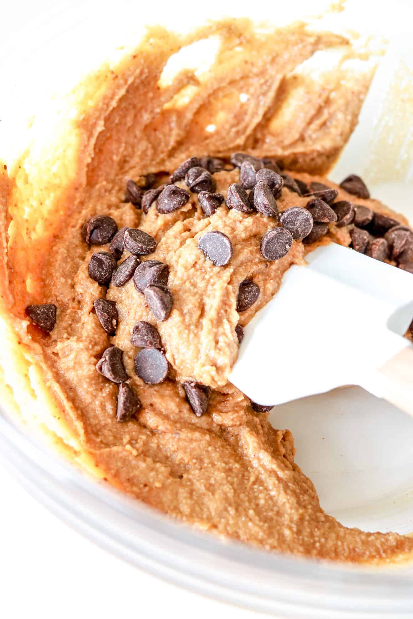 clear bowl with chocolate chip cookie dough batter