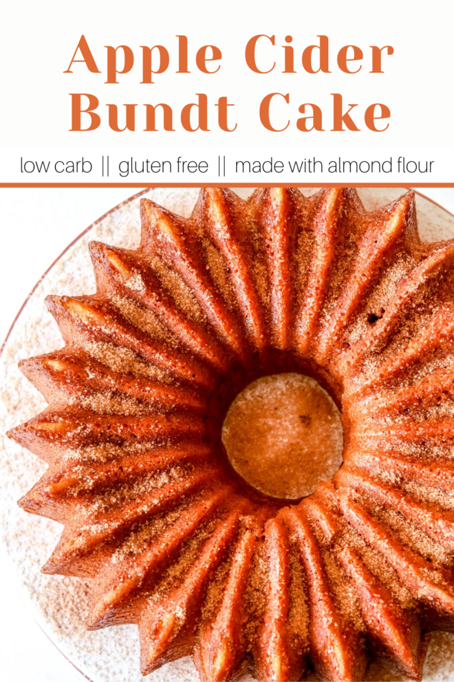overhead image of apple cider bundt cake with cinnamon sugar on top on a cake stand on a white counter