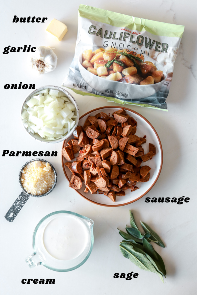 overhead image of ingredients to make Trader Joe's cauliflower gnocchi with sausage, caramelized onions, and a creamy Parmesan sauce