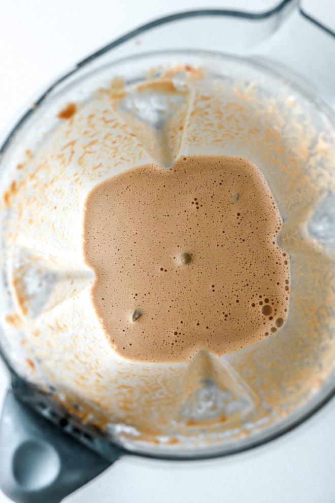 overhead image of a blender with hazelnut coffee blended up