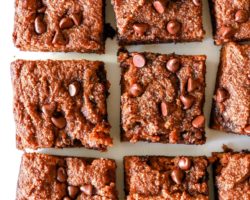 overhead image of chocolate chip pumpkin spice blondies cut in squares on a white background
