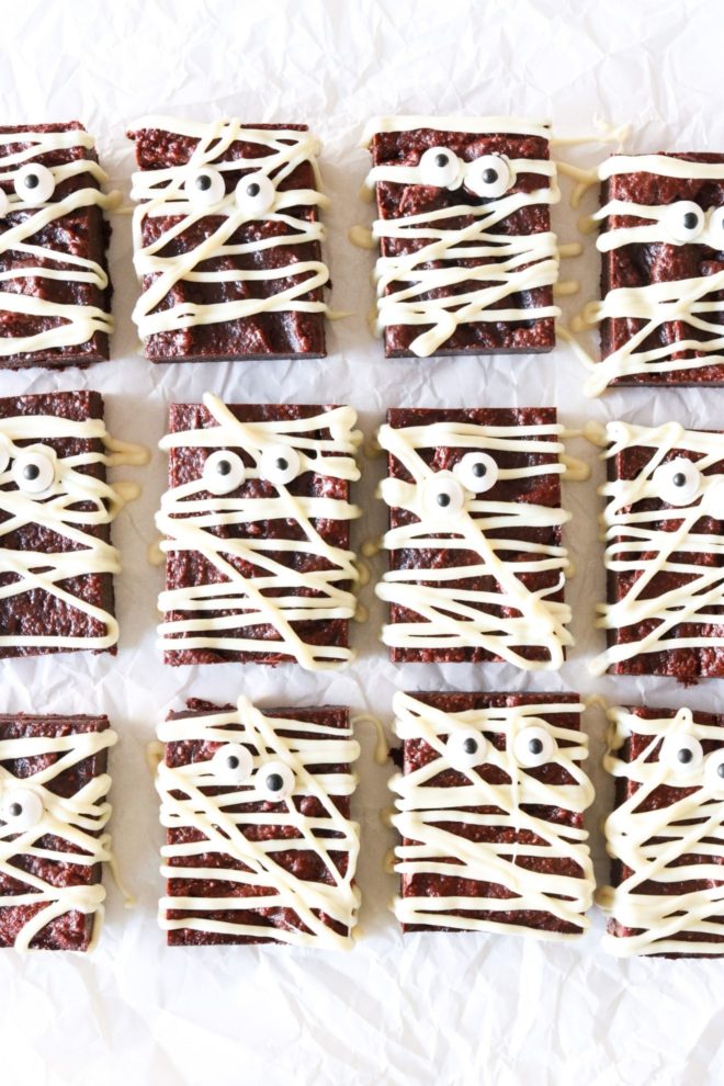 fudgey gluten free brownies with white chocolate and candy eyeballs to look like a mummy