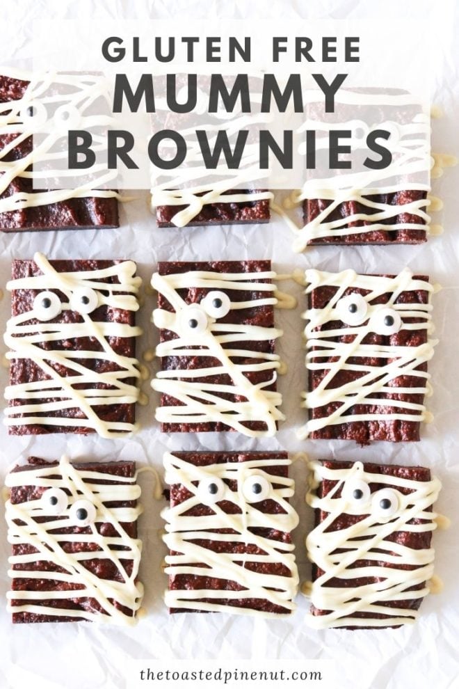 rectangle brownies with white chocolate drizzled and candy eyeballs to look like mummies