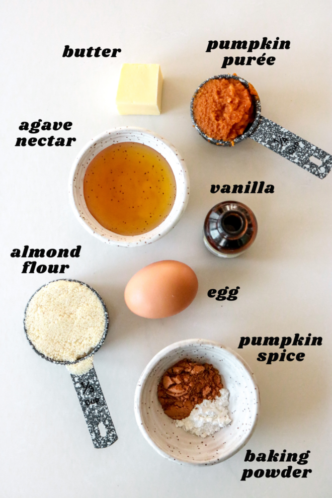 overhead image of ingredients to make pumpkin mug cake on a white counter