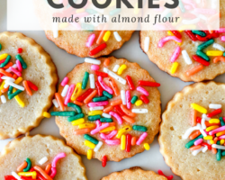 overhead image of circle shortbread cookies with rainbow sprinkles on white counter. text overlay says "gluten free shortbread cookies made with almond flour"