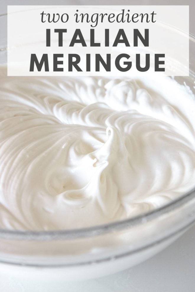 This is a side view of a glass bowl on a white surface. In the bowl is a fluffy white meringue. Text overlay reads "two ingredient Italian meringue."