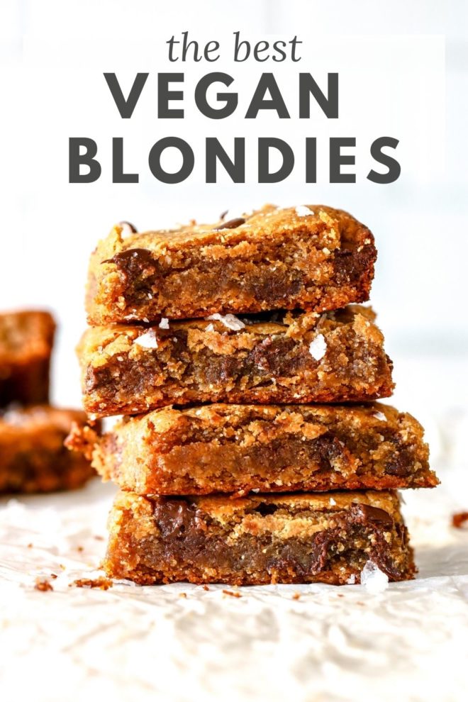 This is a side view of a stack of four blondies. The stack sits on a white surface with more blondies blurred in the background. Text overlay reads "the best vegan blondies."