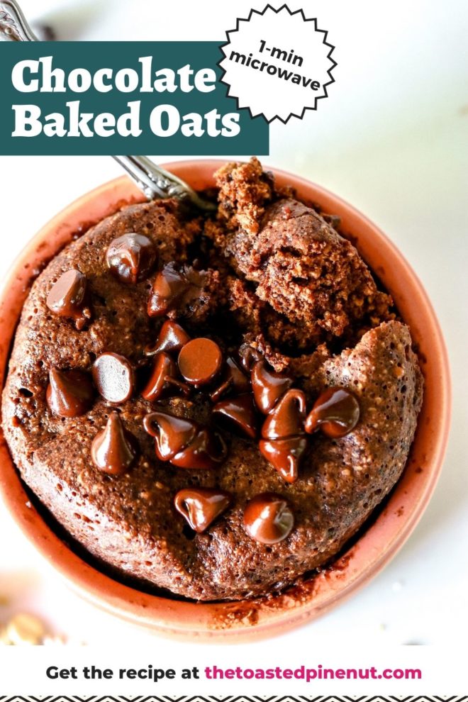 This is an overhead view looking into a light pink dish with chocolate baked oats inside. The baked oats are topped with melted chocolate chips and a spoon scooping out a bite. The dish sits on a white counter with oats scattered around. Text overlay reads "chocolate baked oats 1-min microwave."