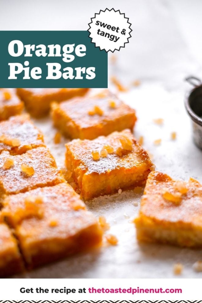This is a side view of orange pie bars on a white piece of parchment paper. The orange bars are topped with candied oranges and powdered sugar. Text overlay reads "sweet & tangy orange pie bars."