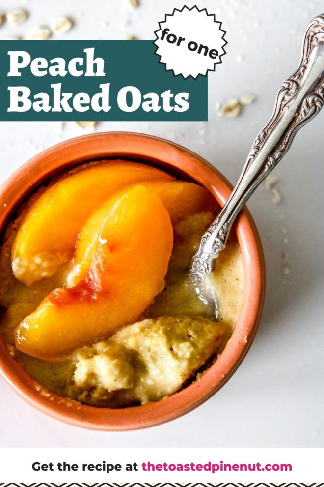 This is an overhead image of peach baked oatmeal in a coral bowl. An antique spoon is dipping into the oats and peach slices are on top. The bowl sits on a white counter with oats scattered around the bowl. Text overlay reads "peach baked oats for one."