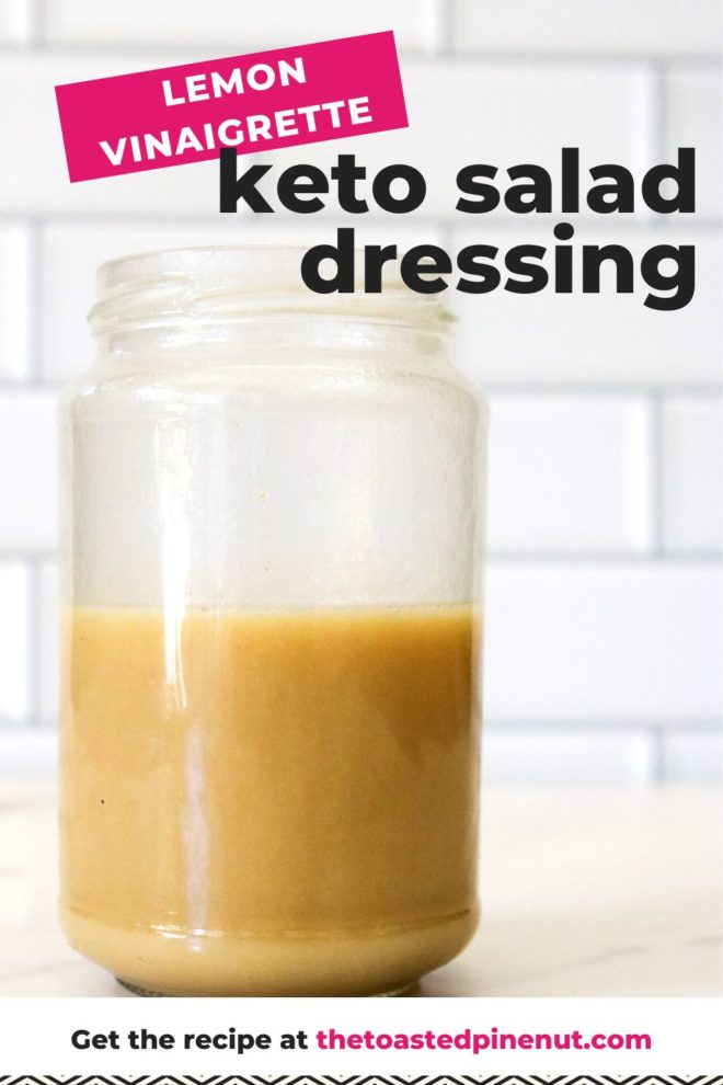 This is a side view of a jar with a lemon vinaigrette filling it halfway up. The jar sits on a marble counter with white subway tile in the background. Text overlay reads "lemon vinaigrette keto salad dressing."