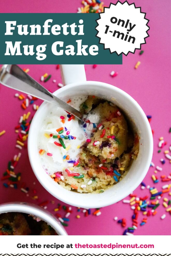 This is an overhead vertical image of two white mugs with funfetti sprinkle cake in them. The mug cake has rainbow sprinkles mixed throughout the cake, is topped with whipped cream with more rainbow sprinkles. The image focuses on one white mug in the center with the second mug cut off in the bottom left corner of the image. Silver spoons are digging into the cake and leaning against the side of the mug. The white mugs sit on a dark pink surface with rainbow sprinkles scattered around them. Text overlay reads "funfetti mug cake only 1-min get the recipe at thetoastedpinenut.com"