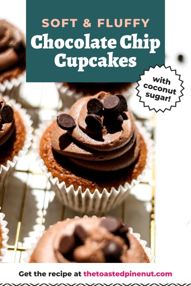 This is a vertical image looking at a line of three cupcakes from a side angle perspective. The image focuses on the center cupcake that is a caramel color with swirled chocolate frosting on top with chocolate chips. The line of cupcakes sits on a gold cooling rack on a white surface. Blurred to the right of the cooling rack is a small bowl with chocolate chips and more chocolate chips scattered around it. Text overlay reads "soft & fluffy chocolate chip cupcakes with coconut sugar! get the recipe at thetoastedpinenut.com"