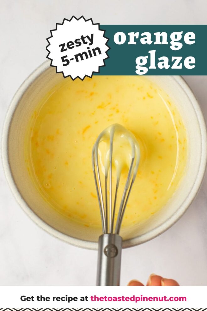 This is an overhead vertical image of a white bowl with an orange glaze in it with specs of orange zest visible. The bowl sits on a white marble counter. A hand coming from the bottom of the image and is holding a small silver whisk dipping into the glaze with the handle leaning against the side of the bowl closest to the bottom of the image. Text overlay reads "zesty 5-min orange glaze."